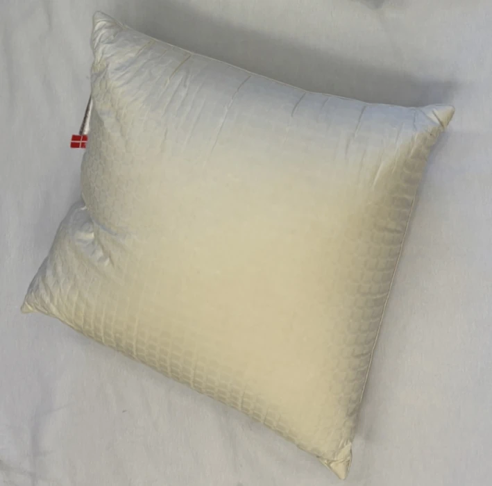 The same pillow after washing — lighter and more even